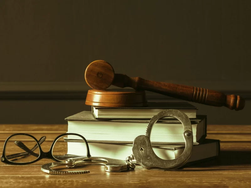 gavel-with-books-old-wooden-desk-scaled